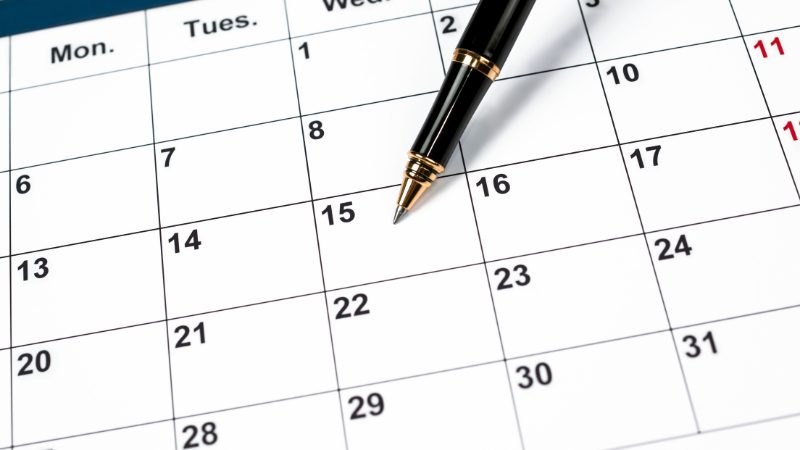 A close-up of a calendar with a pen resting on it, highlighting its use as a fundraising product for student clubs