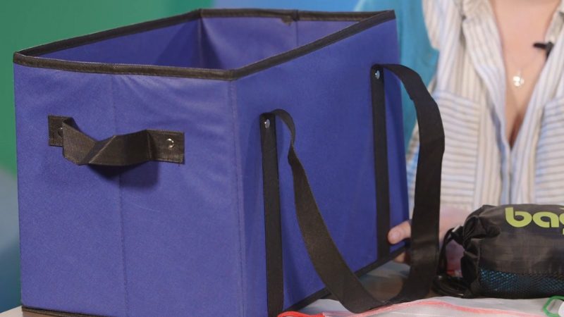A large blue reusable tote bag displayed on a table, showing its value as a fundraising item for student clubs