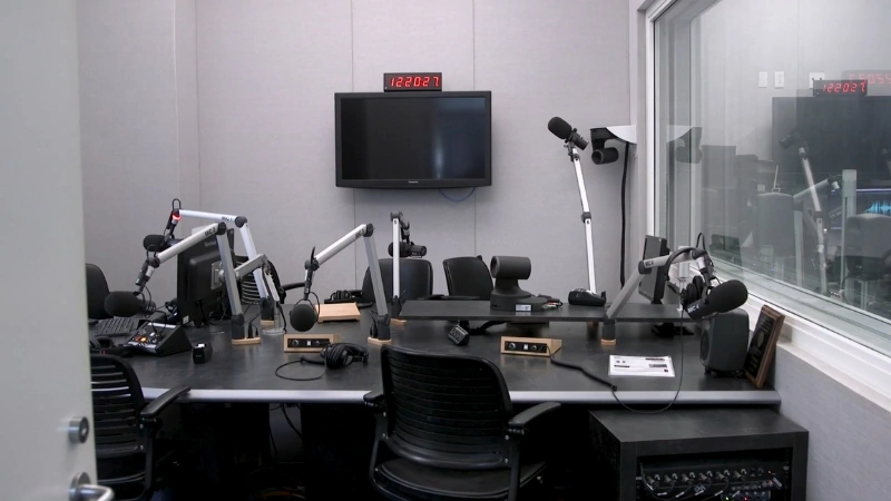 A modern campus radio studio with microphones and recording equipment representing the best colleges for journalism