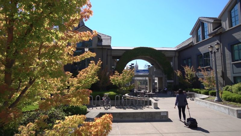 Student walking through the courtyard of the Haas School of Business at the University of California, Berkeley